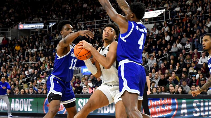 Seton Hall forward KC Ndefo (13) and Seton Hall forward Tyrese Samuel (4) surround Providence...