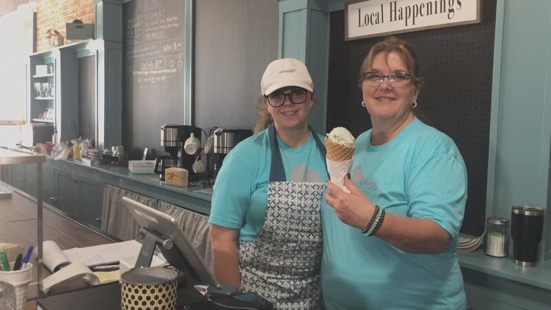 Owner Lori Bergman (right) serves ice cream along with an employee (left) to the North Platte...