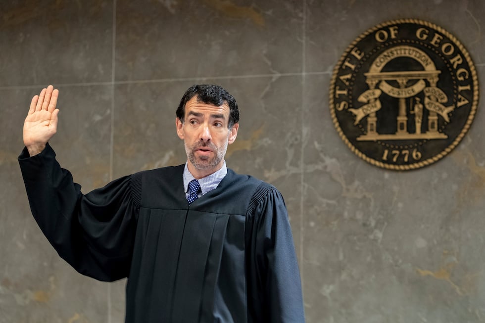 FILE - Fulton County Superior Court Judge Robert McBurney swears in potential jurors during...