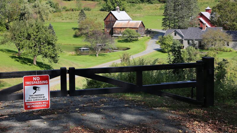 A no-trespassing sign hangs on a gate outside a private property, Thursday, Sept. 21, 2023, in...