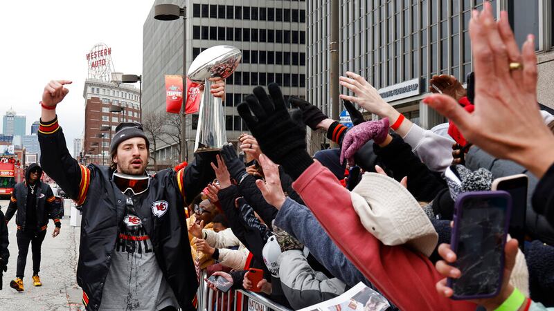 Kansas City Chiefs tight end Noah Gray celebrates with fans during the NFL football team's...