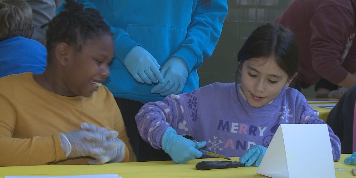 Nebraska Games and Parks show Jefferson Elementary students how to dissect fish to learn more about biology