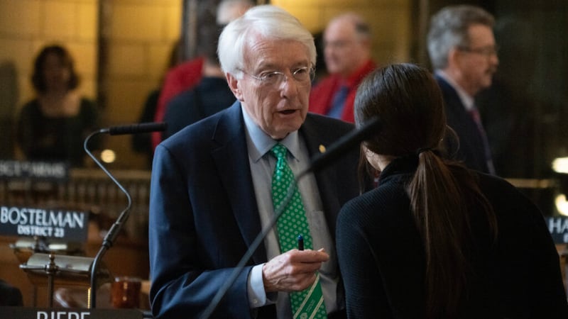State Sen. Merv Riepe of Ralston talks with legislative staff on the floor of the Nebraska...
