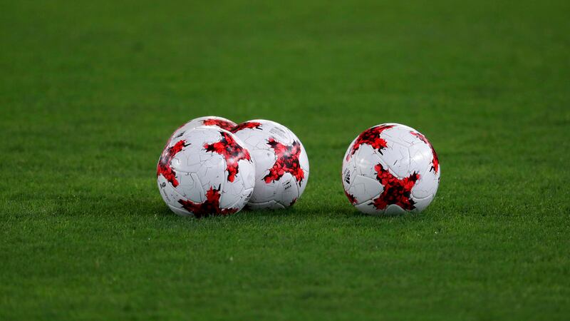 Soccer balls lie on the ground during the Indian team training session ahead for the FIFA U-17...