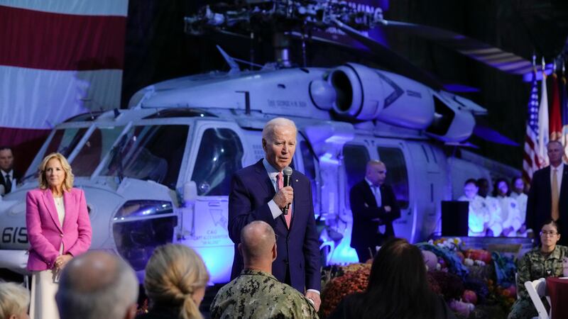 President Joe Biden speaks with service members and their relatives at the Norfolk Naval...