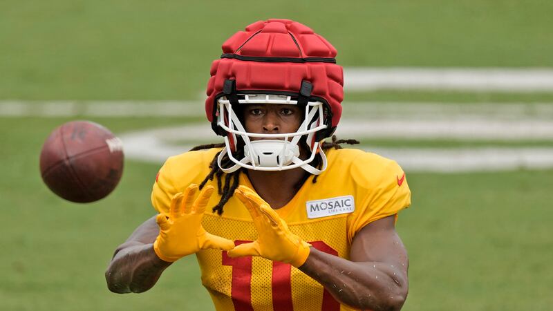 Kansas City Chiefs running back Isiah Pacheco catches a ball during NFL football training camp...