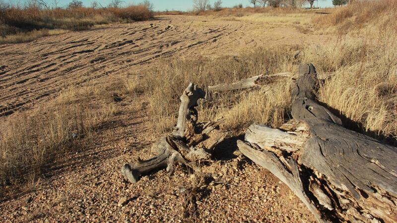 The dry bed of the Arkansas River near the Santa Fe Trail crossing at Cimarron, Kansas. The...
